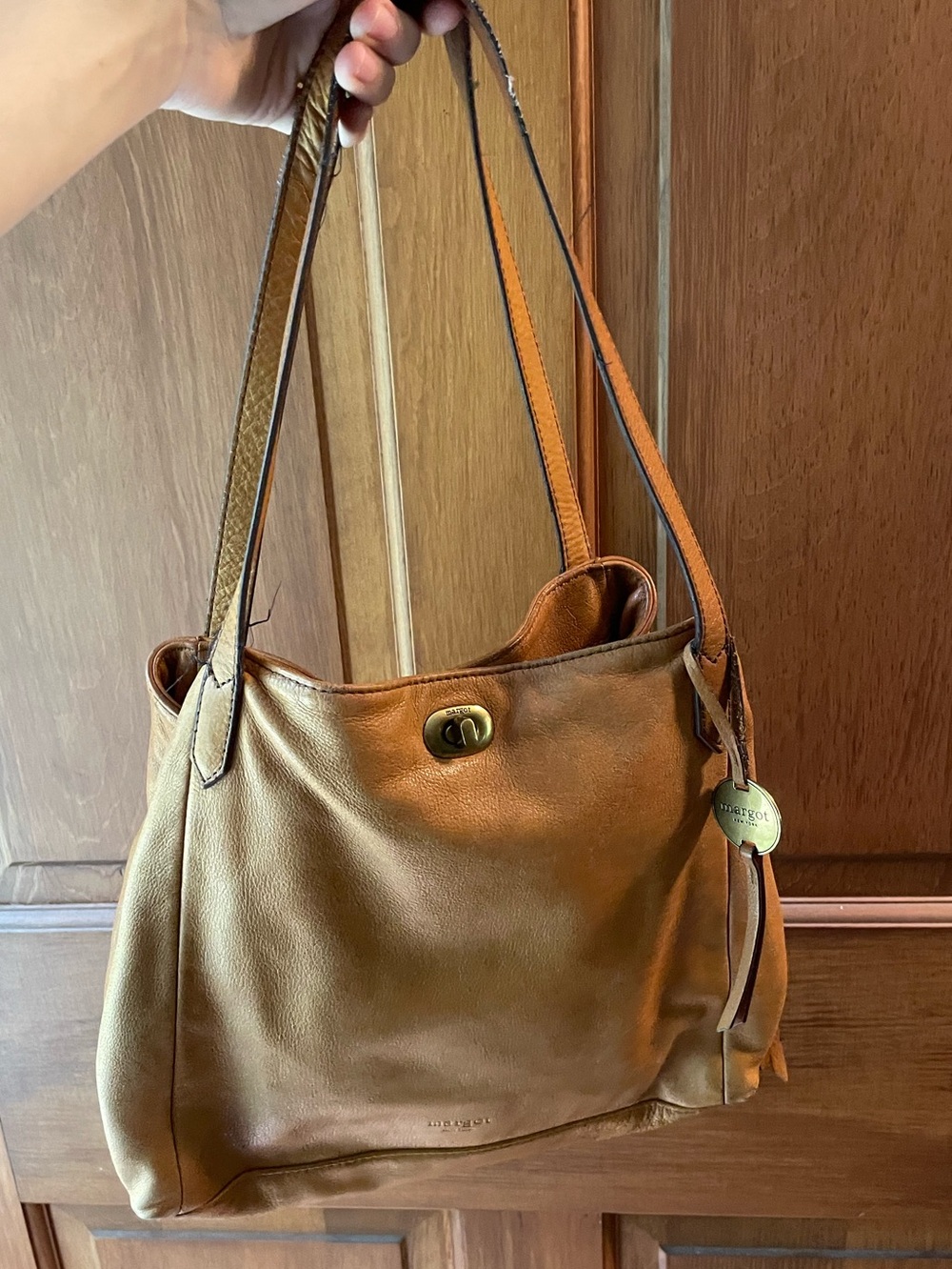 Margot New York Marcy Tote in a cognac brown leather with a turnlock closure